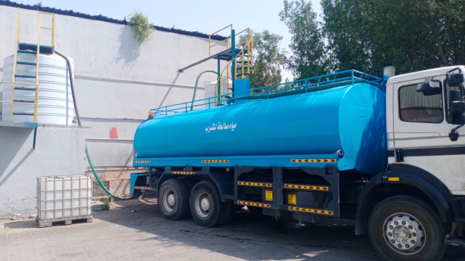 Drinking water tanker at supply station