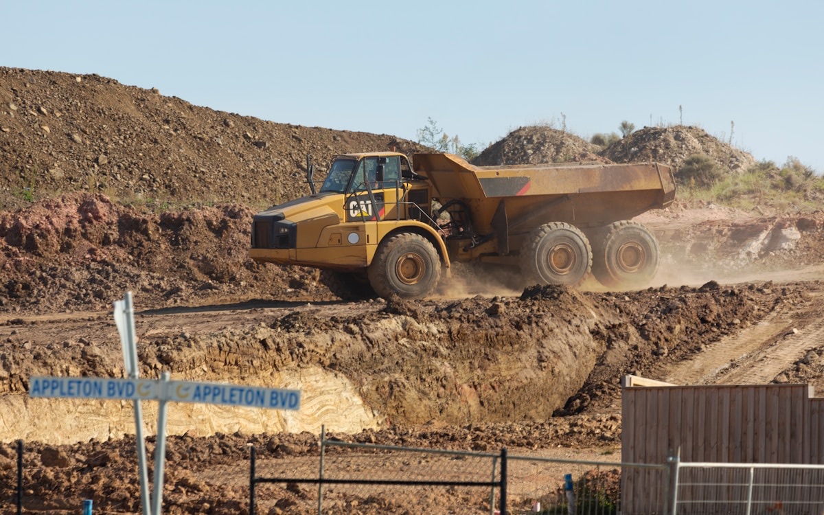 Dump truck moving soil at a construction site