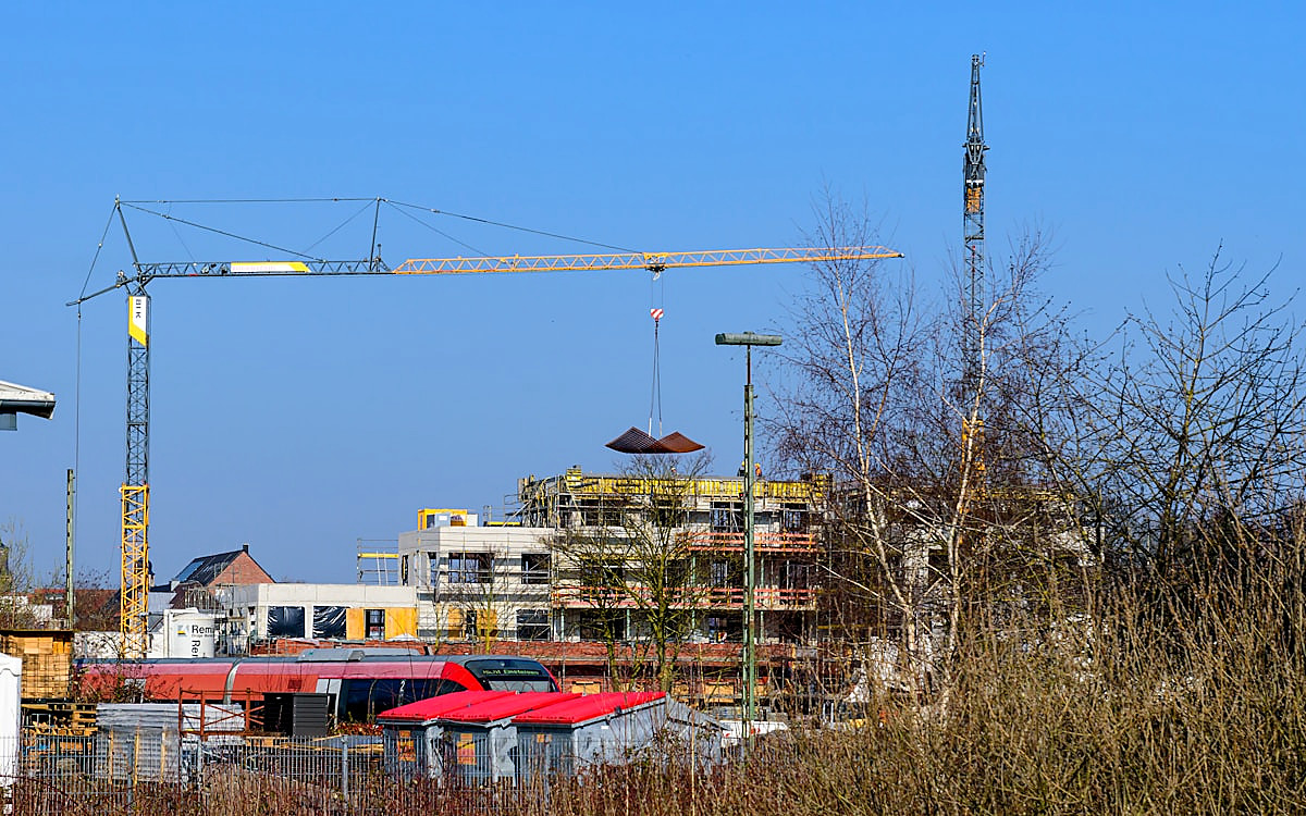 Active construction site with cranes for piling water removal support